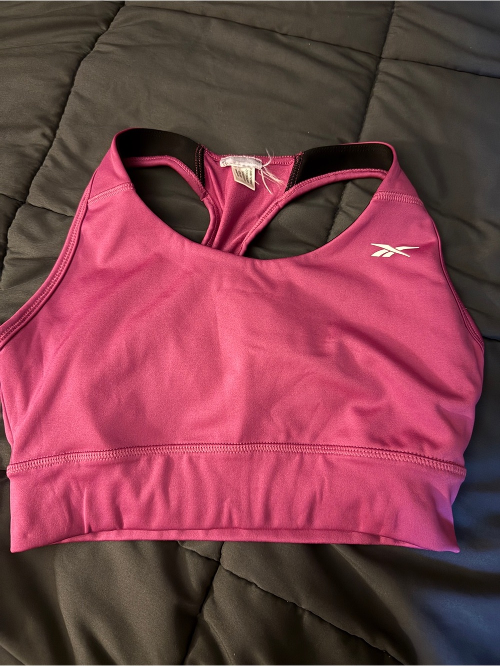 Gently used Reebok fuchsia size medium sports bra